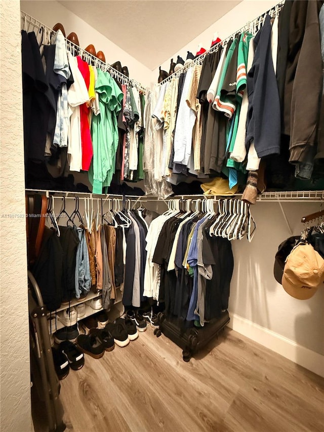 12154 SW 27th St Unit 1102, Miramar, FL 33025 - walk in closet featuring wood finished floors