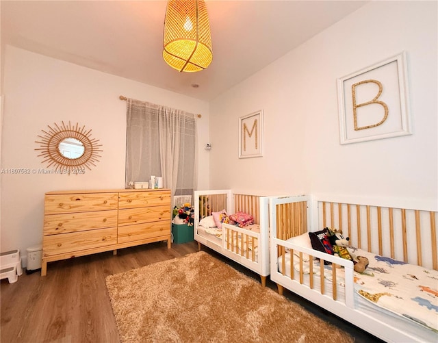 12154 SW 27th St Unit 1102, Miramar, FL 33025 - bedroom with wood finished floors and a crib