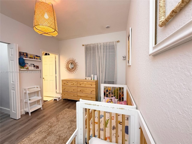 12154 SW 27th St Unit 1102, Miramar, FL 33025 - bedroom with wood finished floors and a textured wall