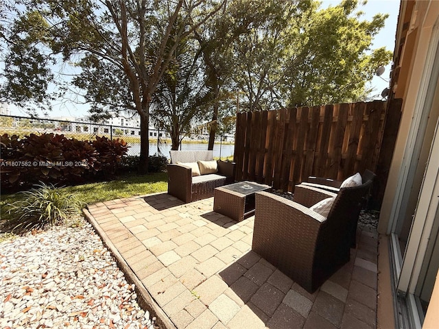 12154 SW 27th St Unit 1102, Miramar, FL 33025 - fenced backyard with a patio area and an outdoor hangout area