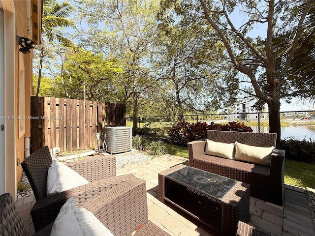 12154 SW 27th St Unit 1102, Miramar, FL 33025 - fenced backyard with an outdoor living space, central AC, and a patio area