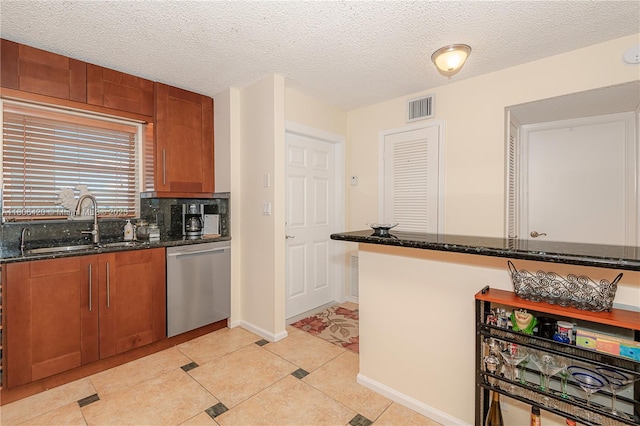 3051 NE 48th St Unit 604, Fort Lauderdale, FL 33308 - kitchen with stainless steel dishwasher, a sink, dark stone countertops, brown cabinetry, and a textured ceiling