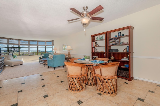3051 NE 48th St Unit 604, Fort Lauderdale, FL 33308 - dining space featuring ceiling fan, a textured ceiling, light tile patterned floors, and baseboards
