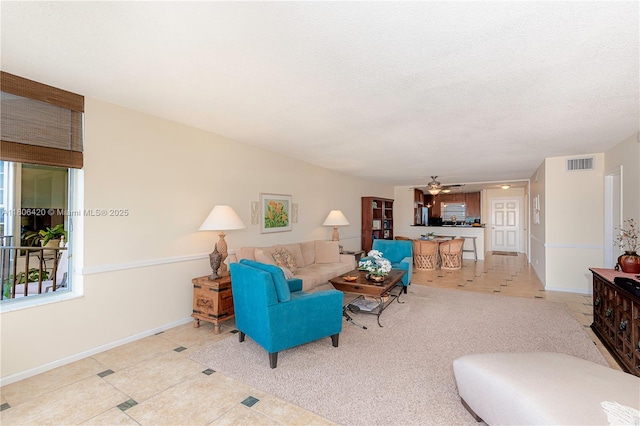 3051 NE 48th St Unit 604, Fort Lauderdale, FL 33308 - living area featuring baseboards, a ceiling fan, and light tile patterned floors