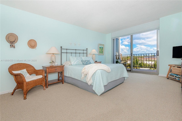 3051 NE 48th St Unit 604, Fort Lauderdale, FL 33308 - bedroom featuring access to exterior, carpet, and baseboards