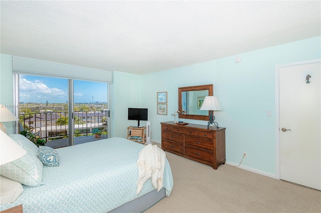 3051 NE 48th St Unit 604, Fort Lauderdale, FL 33308 - carpeted bedroom with access to exterior and baseboards
