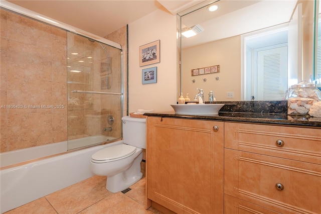 3051 NE 48th St Unit 604, Fort Lauderdale, FL 33308 - bathroom with tile patterned floors, toilet, shower / bath combination with glass door, and vanity