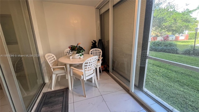 610 NE 12th Ave Unit 102, Hallandale Beach, FL 33009 - sunroom / solarium with outdoor dining area