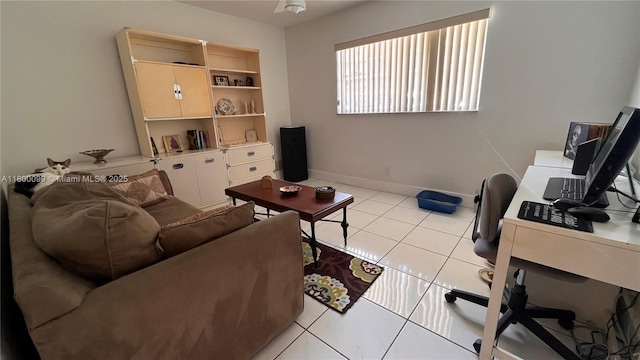 610 NE 12th Ave Unit 102, Hallandale Beach, FL 33009 - living area with a desk and light tile patterned floors