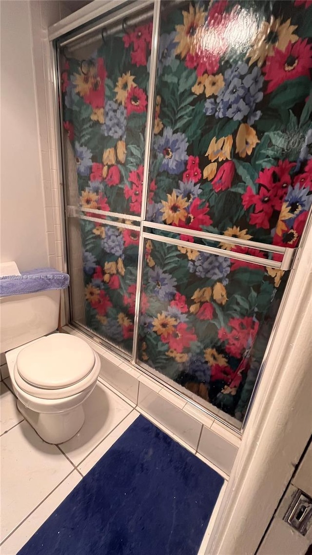 610 NE 12th Ave Unit 102, Hallandale Beach, FL 33009 - bathroom featuring toilet and tile patterned flooring