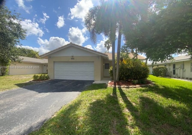 2731 NW 123rd Ave, Coral Springs, FL 33065 - ranch-style house with stucco siding, asphalt driveway, a garage, and a front yard
