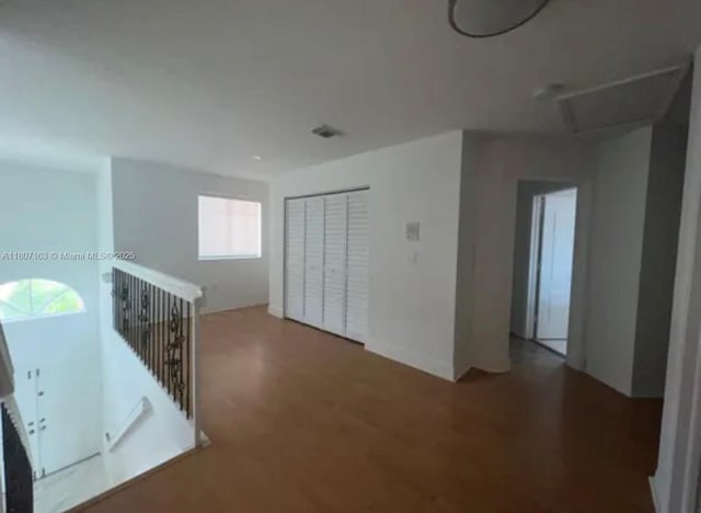 16461 SW 100th Ter, Miami, FL 33196 - spare room featuring wood finished floors and attic access
