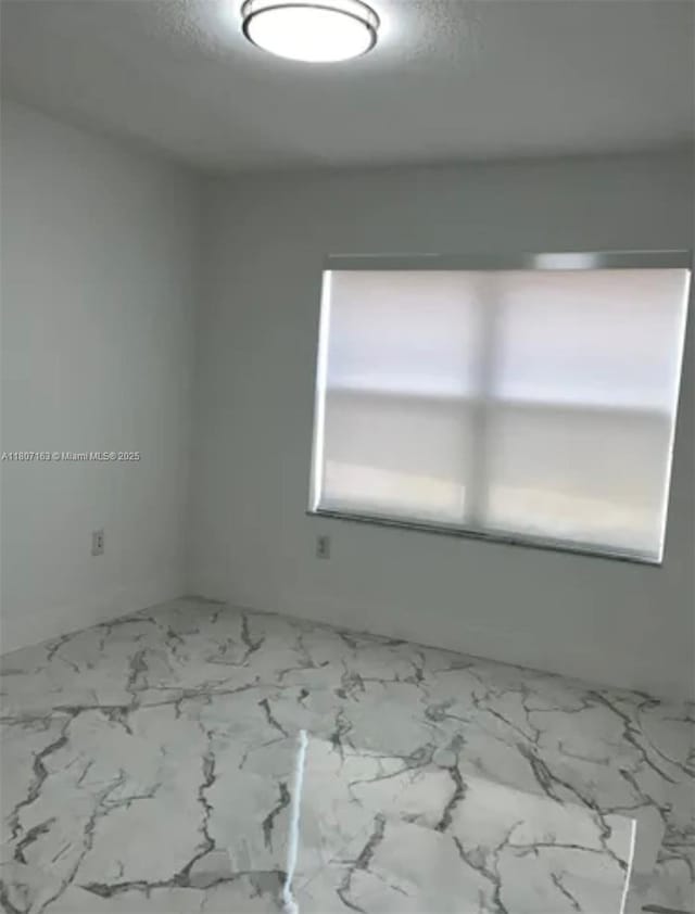 16461 SW 100th Ter, Miami, FL 33196 - empty room with marble look tiles