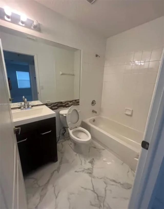 16461 SW 100th Ter, Miami, FL 33196 - full bathroom with toilet, vanity, marble finish floors, and shower / tub combination