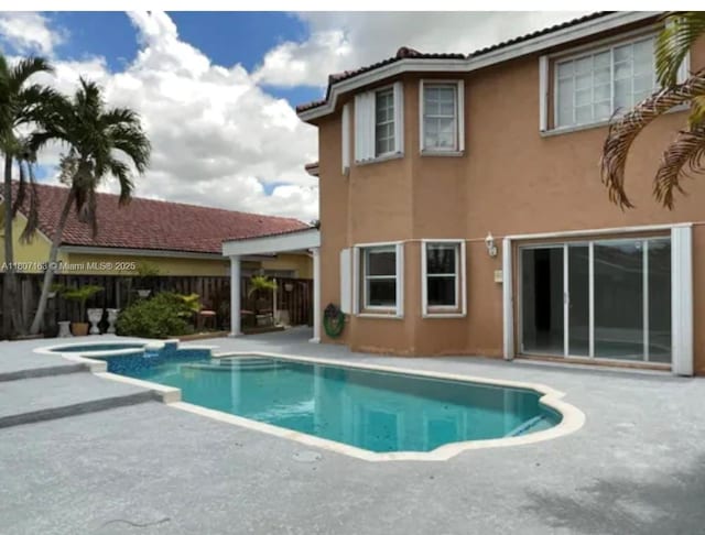 16461 SW 100th Ter, Miami, FL 33196 - view of pool with a patio and a pool with connected hot tub