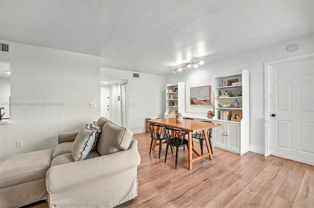 2055 SW 122nd Ave Unit 524, Miami, FL 33175 - dining area featuring light wood-style flooring and baseboards