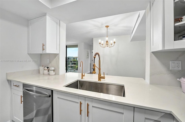 2075 SW 122nd Ave Unit 517, Miami, FL 33175 - kitchen featuring dishwasher, a sink, white cabinets, a chandelier, and a peninsula