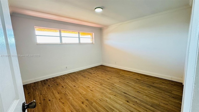 11195 SW 1st St Unit 319, Sweetwater, FL 33174 - empty room featuring crown molding, wood-type flooring, and baseboards