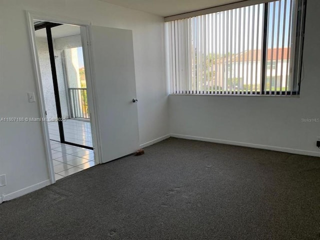 4090 Tivoli Ct Unit 201, Lake Worth, FL 33467 - spare room featuring carpet floors and baseboards