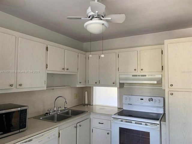 4090 Tivoli Ct Unit 201, Lake Worth, FL 33467 - kitchen featuring white appliances, under cabinet range hood, a sink, light countertops, and a ceiling fan