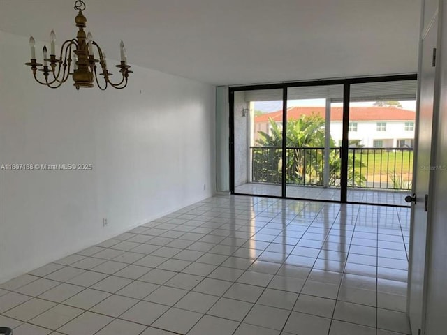4090 Tivoli Ct Unit 201, Lake Worth, FL 33467 - unfurnished room featuring a wall of windows, a chandelier, and light tile patterned floors