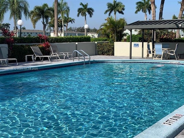 4090 Tivoli Ct Unit 201, Lake Worth, FL 33467 - community pool with a patio area