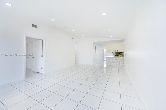 9021 NW 121st Ter Unit 85, Hialeah Gardens, FL 33018 - spare room with recessed lighting, light tile patterned flooring, and baseboards