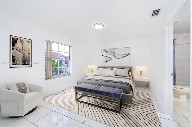 9021 NW 121st Ter Unit 85, Hialeah Gardens, FL 33018 - bedroom featuring light tile patterned flooring and connected bathroom