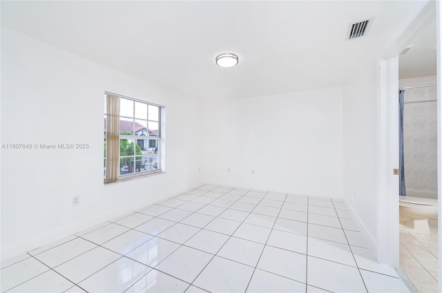 9021 NW 121st Ter Unit 85, Hialeah Gardens, FL 33018 - unfurnished room featuring light tile patterned flooring