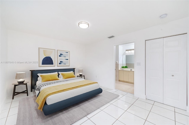 9021 NW 121st Ter Unit 85, Hialeah Gardens, FL 33018 - bedroom featuring light tile patterned flooring, a closet, and ensuite bathroom