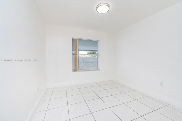 9021 NW 121st Ter Unit 85, Hialeah Gardens, FL 33018 - unfurnished room with light tile patterned flooring and baseboards