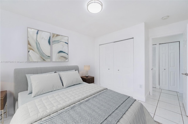 9021 NW 121st Ter Unit 85, Hialeah Gardens, FL 33018 - bedroom featuring a closet, light tile patterned flooring, and baseboards