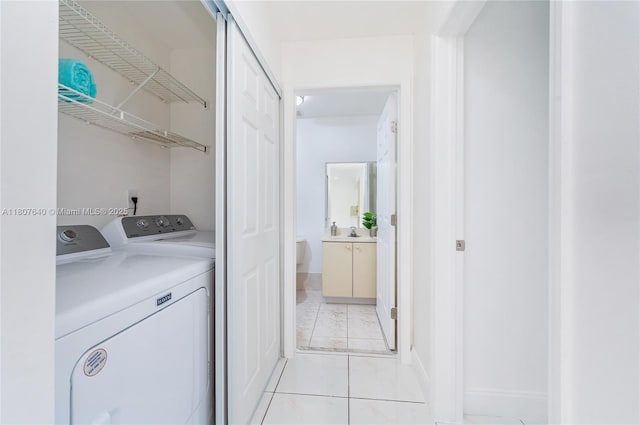 9021 NW 121st Ter Unit 85, Hialeah Gardens, FL 33018 - laundry area featuring independent washer and dryer and light tile patterned floors