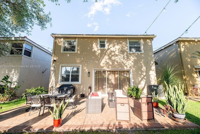 4832 SW 159th Ave, Miramar, FL 33027 - rear view of property featuring stucco siding, a patio area, and outdoor dining space