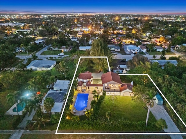 321 SW 1st Ave, Boynton Beach, FL 33435 - aerial view at dusk of property boundaries highlighted and view of pool