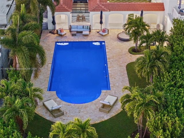 321 SW 1st Ave, Boynton Beach, FL 33435 - outdoor pool featuring outdoor lounge area and a patio area