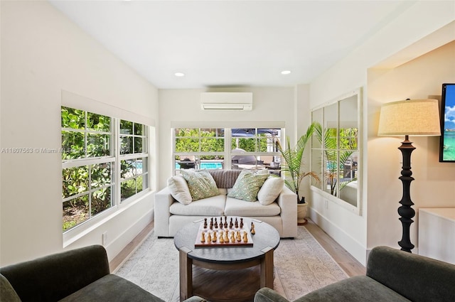 321 SW 1st Ave, Boynton Beach, FL 33435 - living room with an AC wall unit, wood finished floors, and recessed lighting