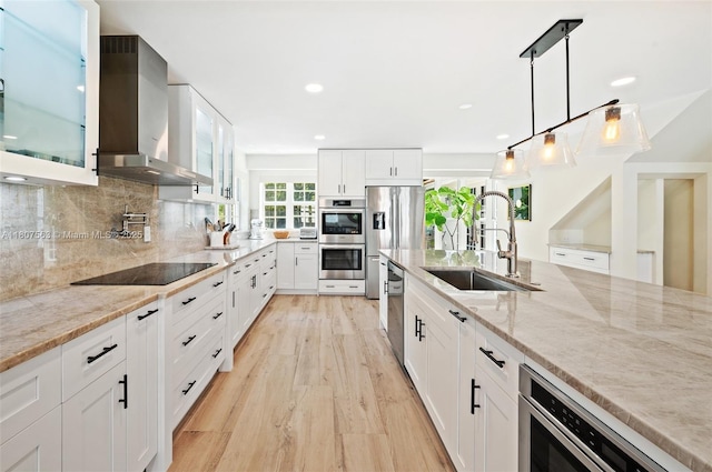 321 SW 1st Ave, Boynton Beach, FL 33435 - kitchen with wall chimney exhaust hood, stainless steel appliances, glass insert cabinets, light stone countertops, and recessed lighting