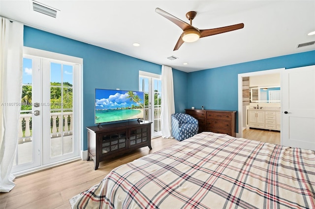 321 SW 1st Ave, Boynton Beach, FL 33435 - bedroom featuring access to outside, multiple windows, wood finished floors, and recessed lighting