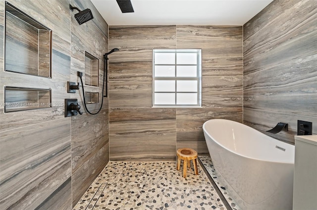 321 SW 1st Ave, Boynton Beach, FL 33435 - full bathroom featuring a freestanding tub and tiled shower