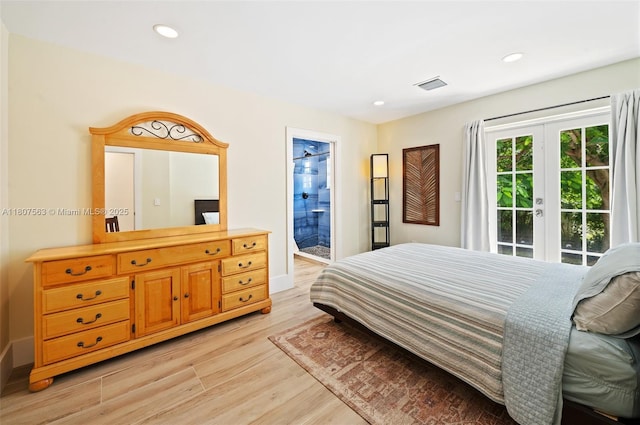 321 SW 1st Ave, Boynton Beach, FL 33435 - bedroom featuring light wood-style floors, access to exterior, recessed lighting, and ensuite bath