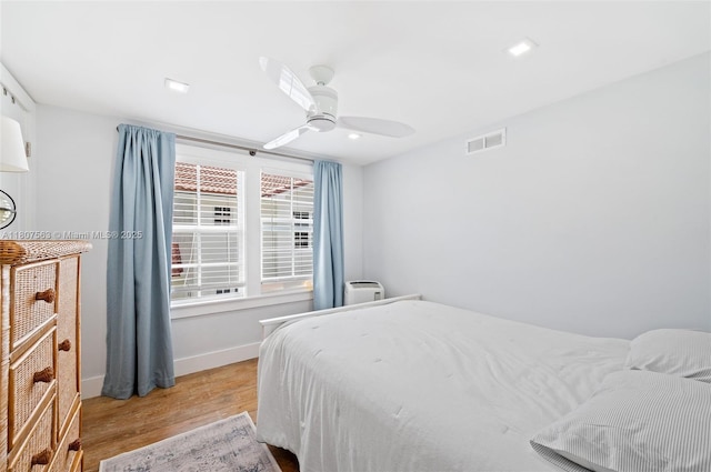 321 SW 1st Ave, Boynton Beach, FL 33435 - bedroom featuring light wood-type flooring, a ceiling fan, and recessed lighting