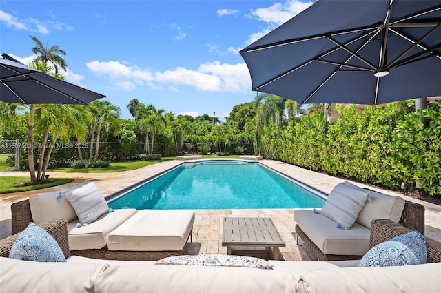 321 SW 1st Ave, Boynton Beach, FL 33435 - swimming pool with an outdoor living space, a patio, and a fenced backyard