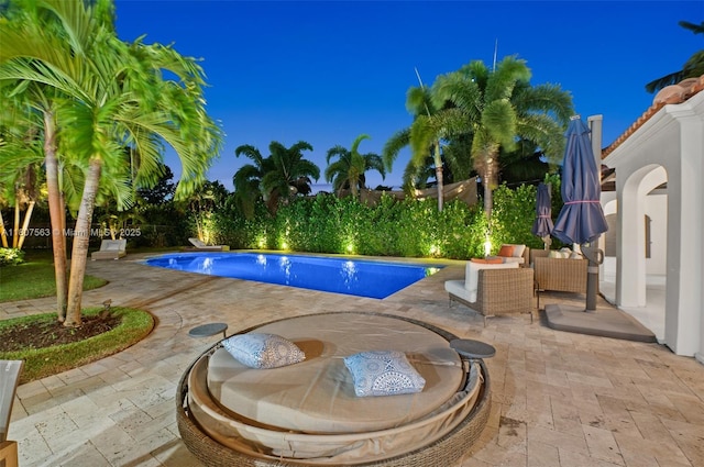 321 SW 1st Ave, Boynton Beach, FL 33435 - pool at twilight featuring a patio