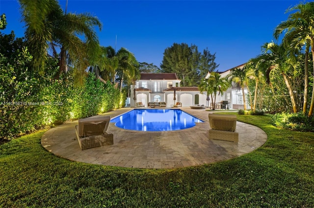 321 SW 1st Ave, Boynton Beach, FL 33435 - outdoor pool with a lawn, a patio, and a storage unit