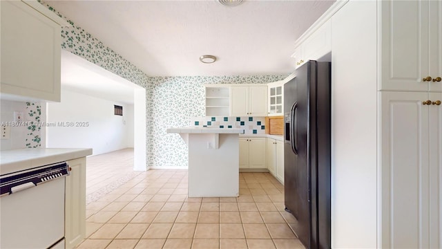 17535 SW 91st Ave, Palmetto Bay, FL 33157 - kitchen featuring dishwasher, black fridge, wallpapered walls, open shelves, and light countertops