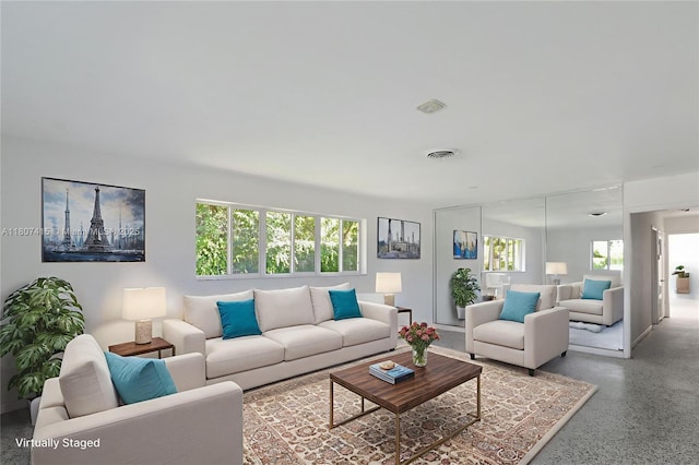 17535 SW 91st Ave, Palmetto Bay, FL 33157 - living room featuring plenty of natural light and speckle patterned floor