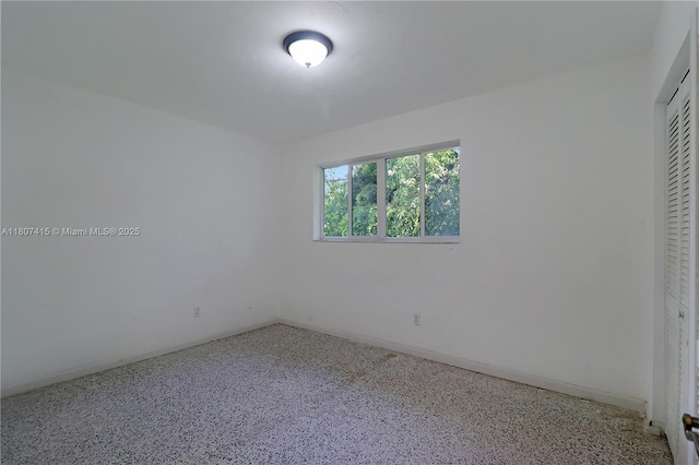 17535 SW 91st Ave, Palmetto Bay, FL 33157 - unfurnished bedroom featuring a closet and speckled floor