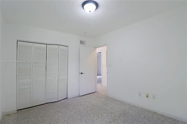 17535 SW 91st Ave, Palmetto Bay, FL 33157 - unfurnished bedroom featuring a closet and speckle patterned floor