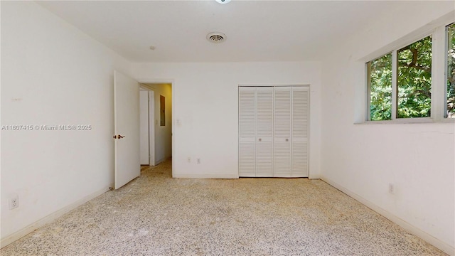 17535 SW 91st Ave, Palmetto Bay, FL 33157 - unfurnished bedroom with speckle patterned floor and a closet